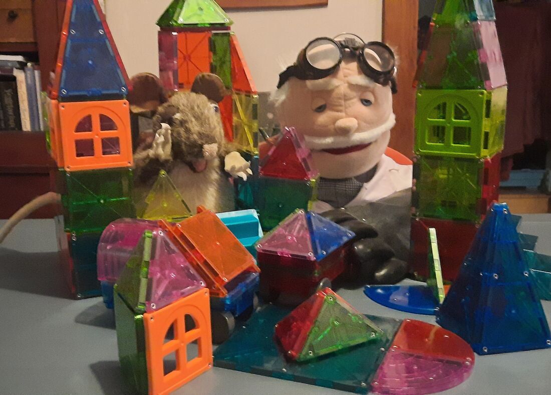 Boomer & Dr. Fizz,  showing off their  Mouse House Metropolis